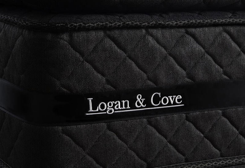 Image of the logo stitching on the sidewall of the Logan & Cove luxury hybrid mattress.